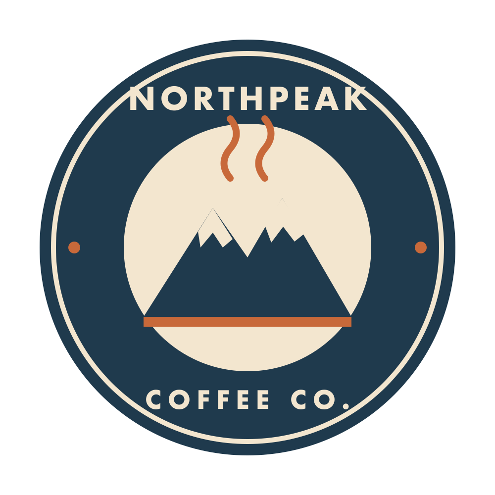 Round navy coffee shop badge logo with a cream mountain, rust-colored steam lines and the words Northpeak Coffee Co., original PNG at 4x zoom